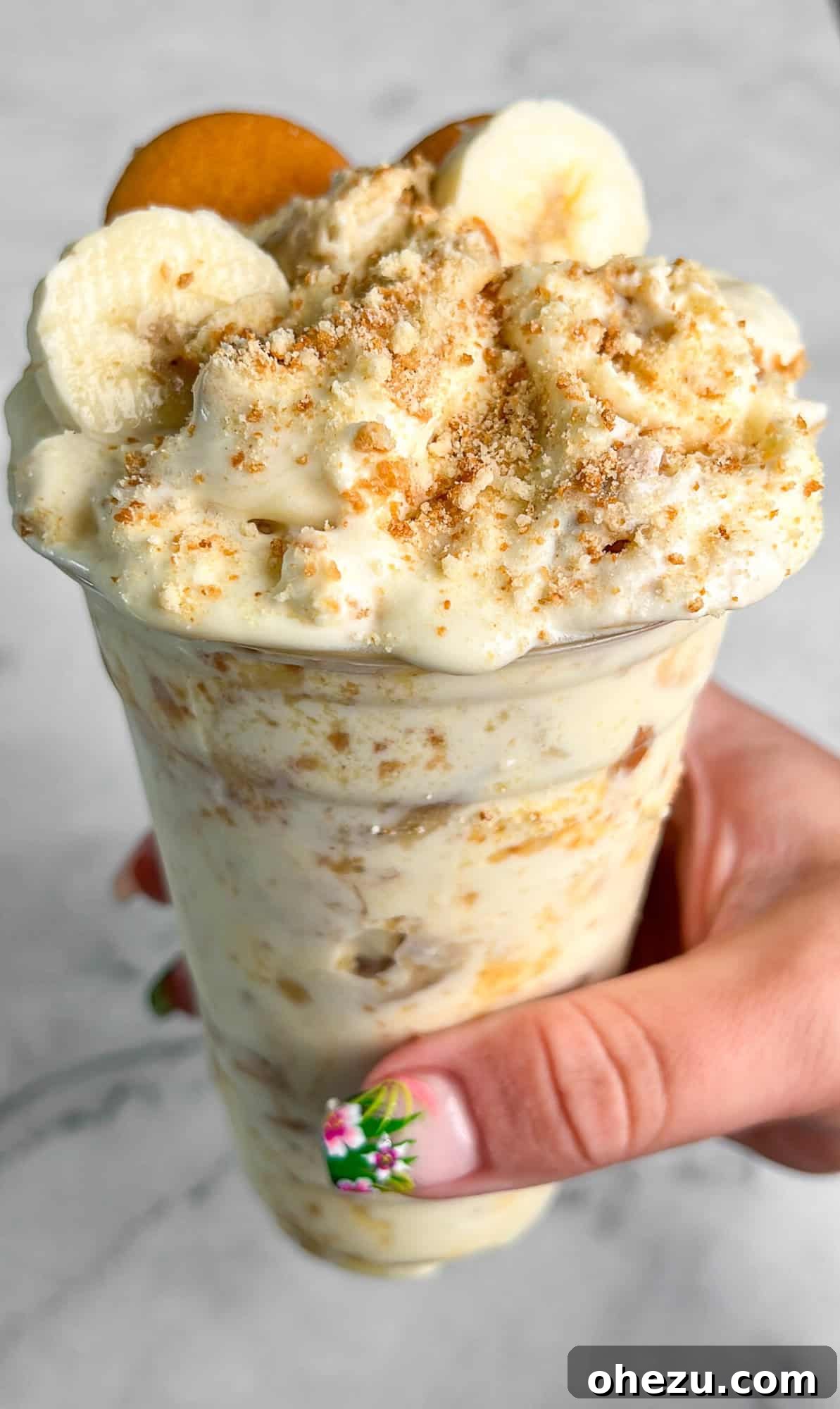 A bowl of creamy Chick-fil-A Banana Pudding with Nilla wafers and banana slices.