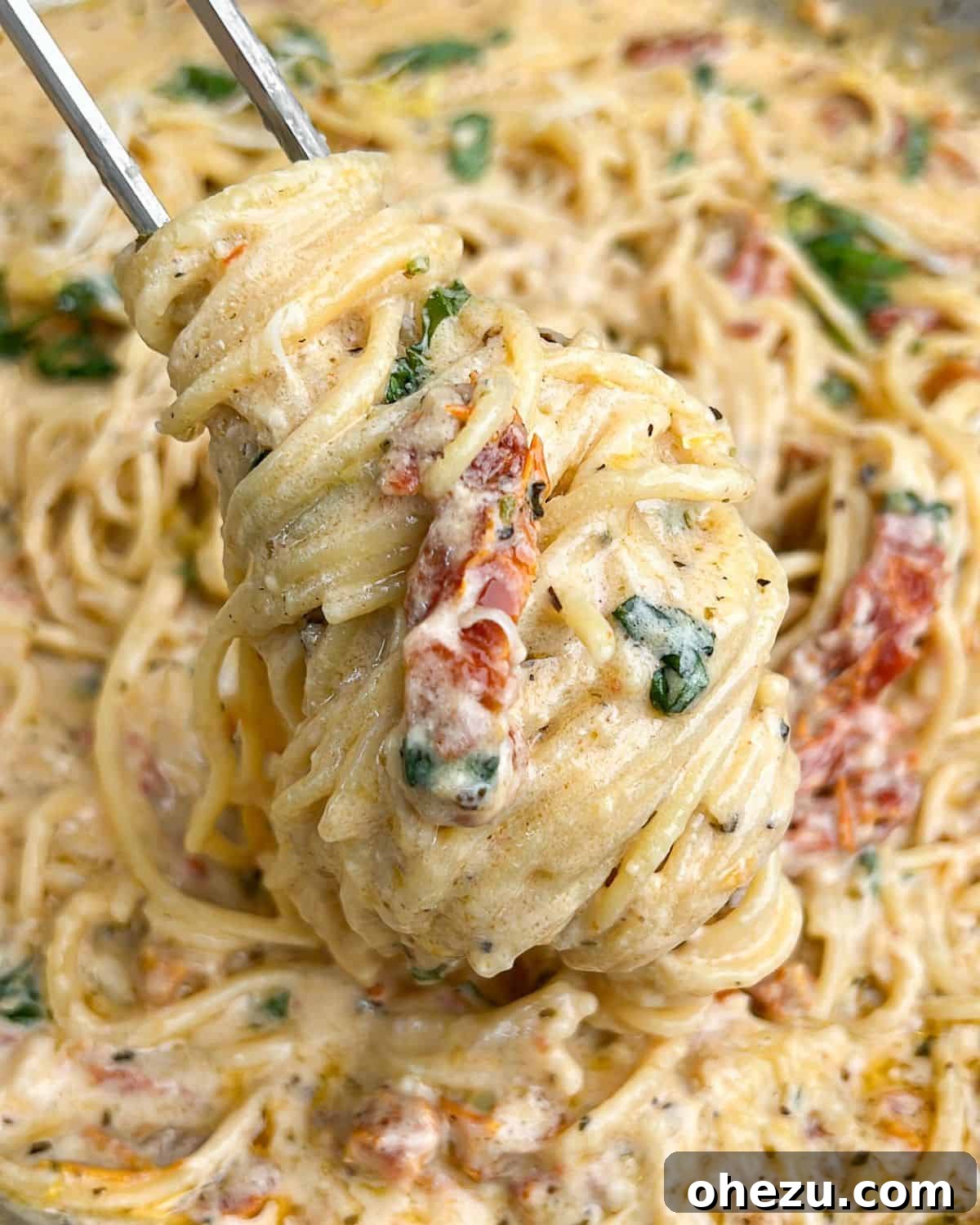 Tuscan Skillet Cream Pasta 2 Easy one-pan creamy Tuscan pasta with sun-dried tomatoes in a skillet, ready to serve.