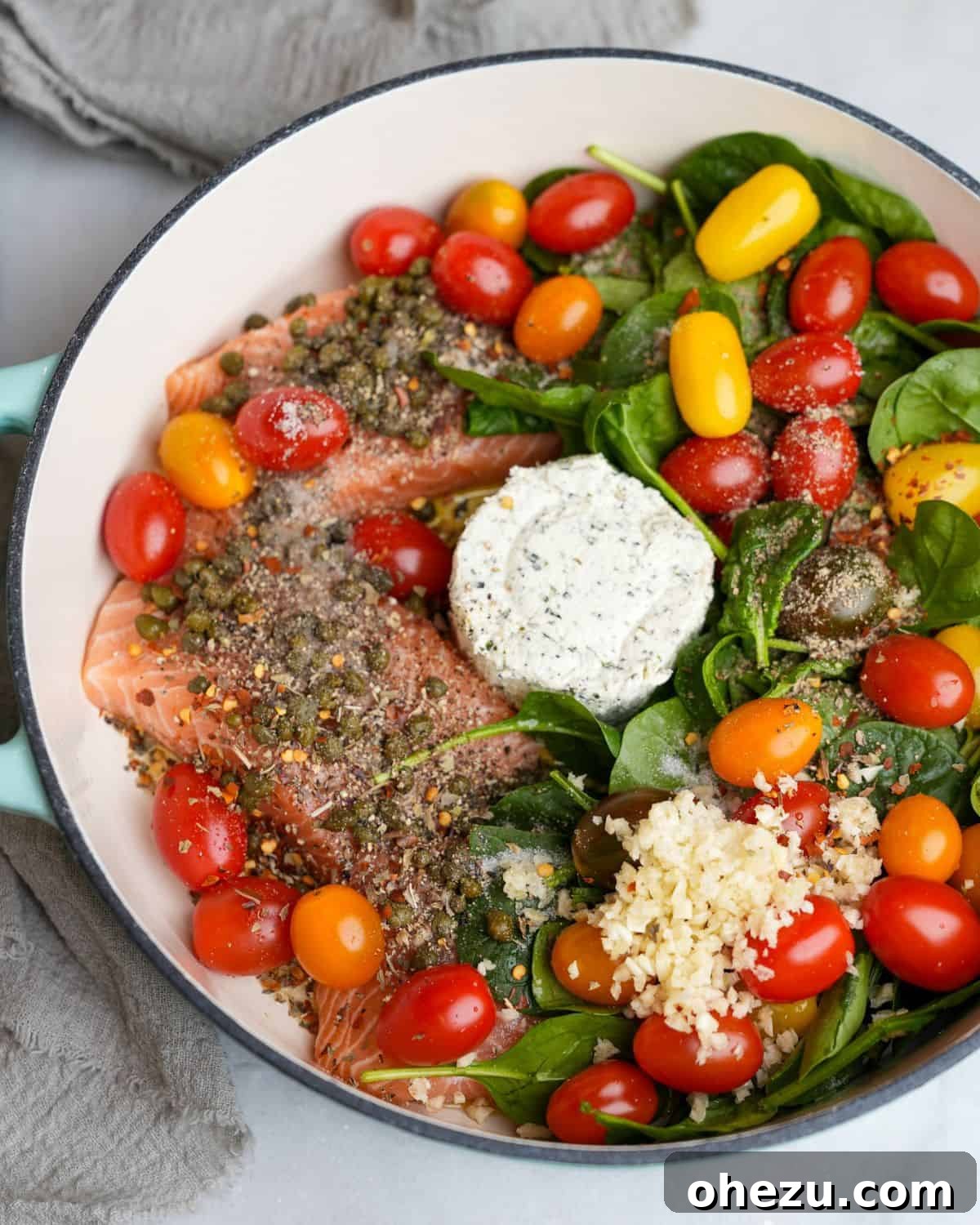 25 Effortless Meals for Busy School Days 19 Ingredients for Boursin Tomato Pasta with Salmon arranged in a baking dish