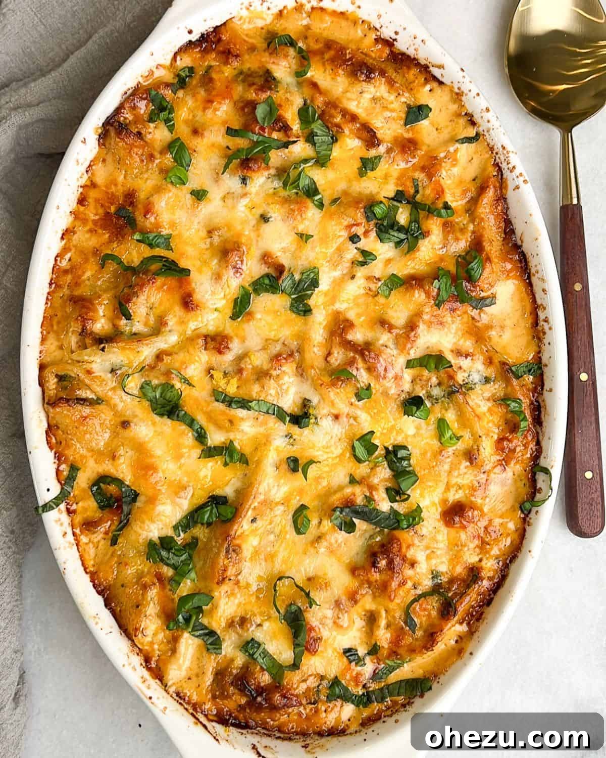 These Marry Me Chicken Stuffed Shells feature a succulent chicken, sun-dried tomato, and ricotta filling, baked in a rich, creamy sauce for an unforgettable meal. Delicious Marry Me Chicken Stuffed Shells baked golden in a ceramic dish, ready to serve.
