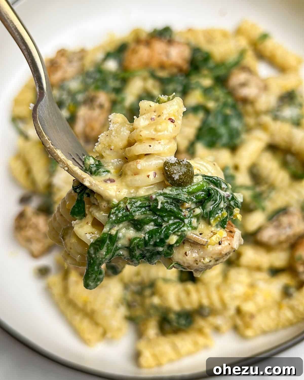 chicken pesto pasta on a fork