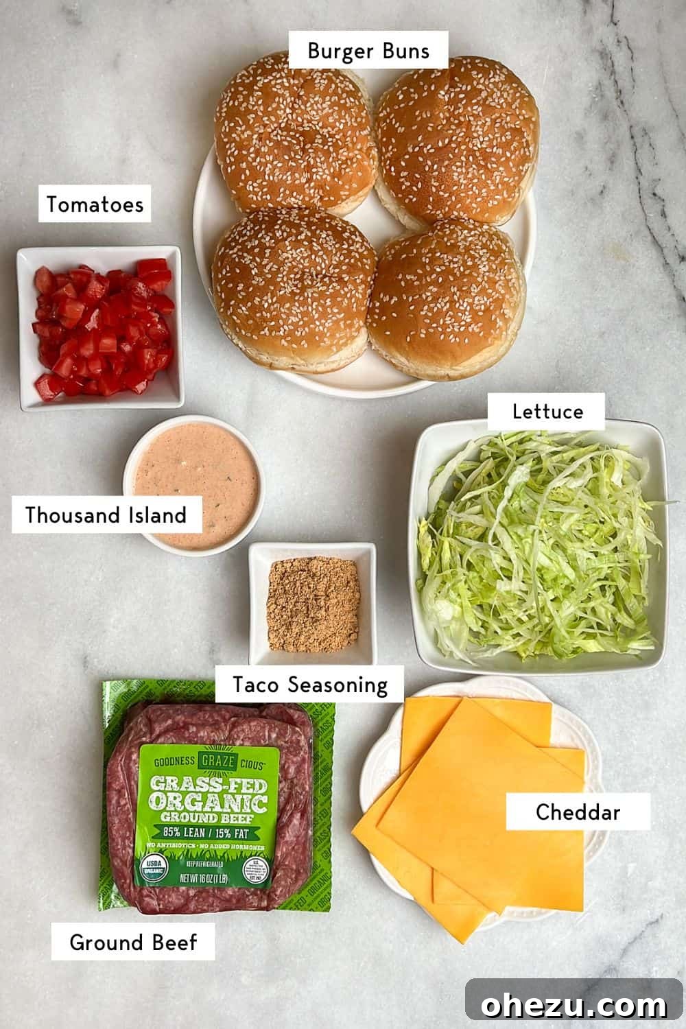 A flat lay photograph displaying all the fresh and vibrant ingredients needed to create delicious taco burgers.