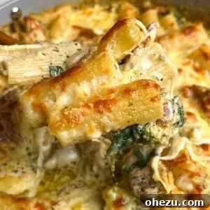 Close-up image of pesto chicken pasta bake.