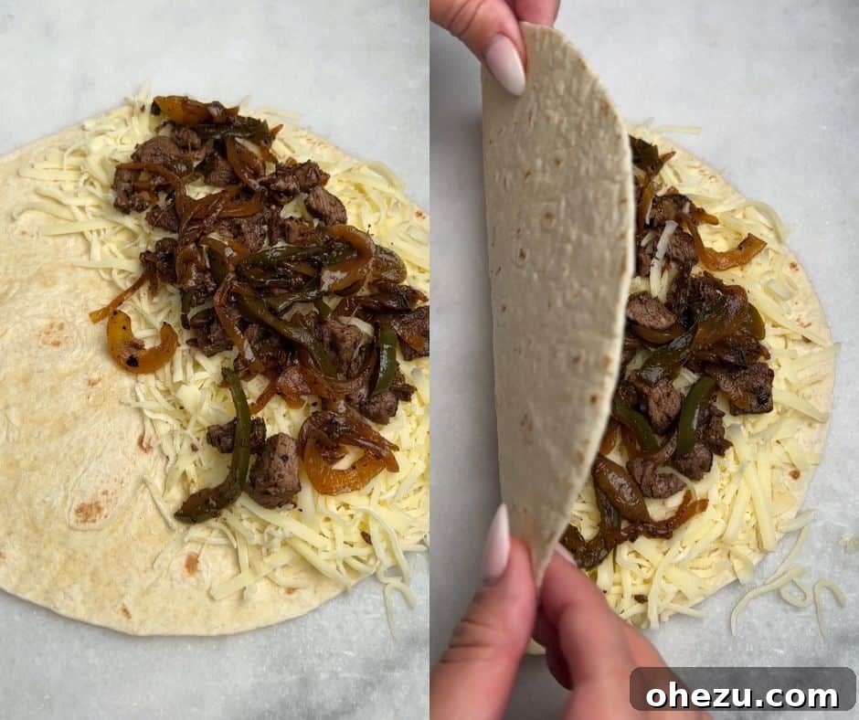 Smoky Steak Quesadillas with Creamy Chipotle Drizzle 5 Detailed shot of assembling quesadillas, showing layers of cheese, steak, and vegetables on a tortilla before folding.