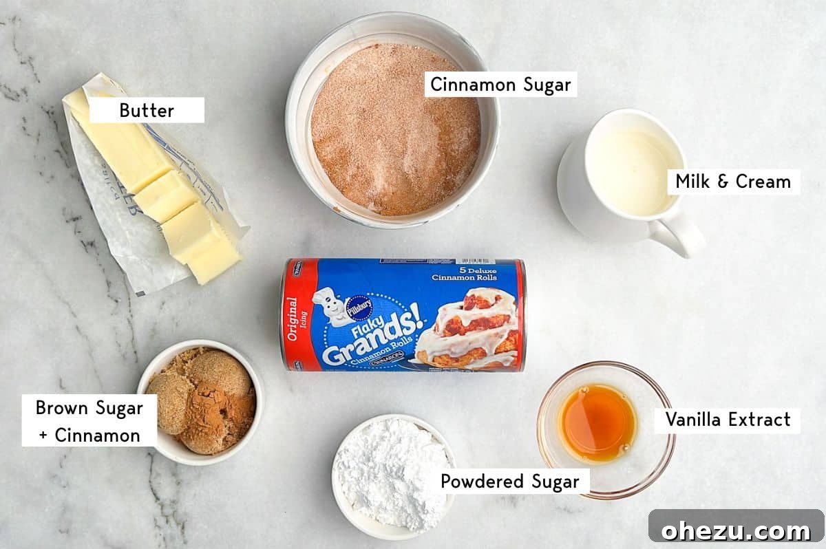 This shortcut recipe uses store-bought dough to create warm, buttery cinnamon roll bites in under an hour. You won't be able to resist! A curated display of key ingredients for making cinnamon roll bites, including canned dough, butter, sugar, cinnamon, and heavy cream.