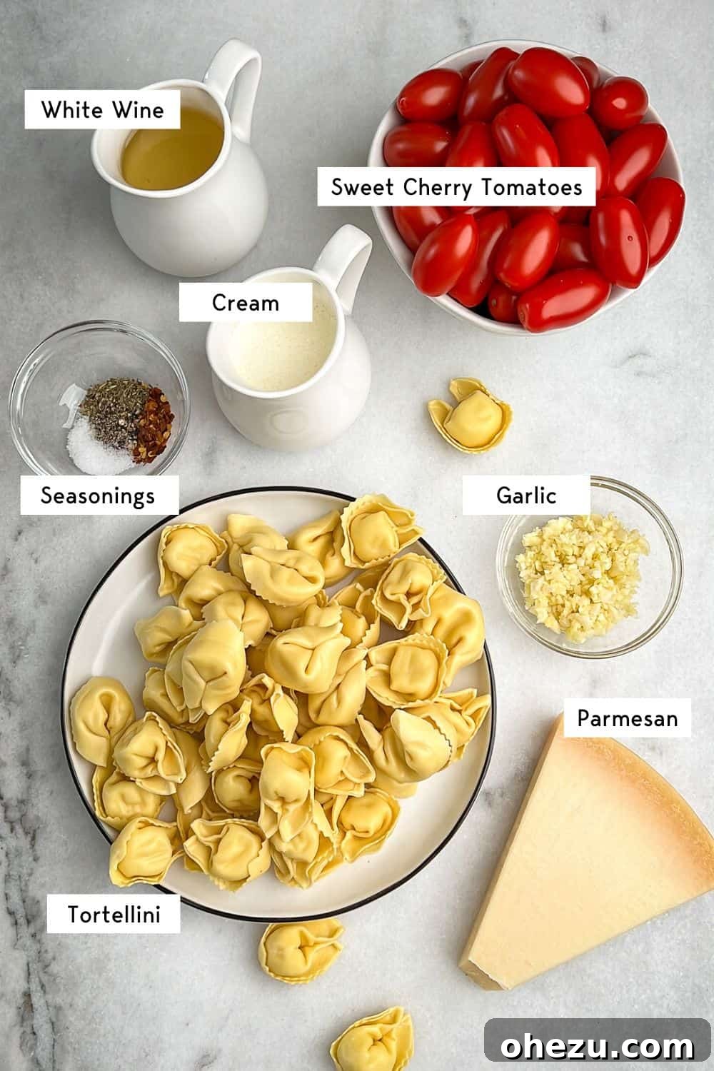 Measured ingredients for easy creamy tomato pasta recipe laid out on a counter.