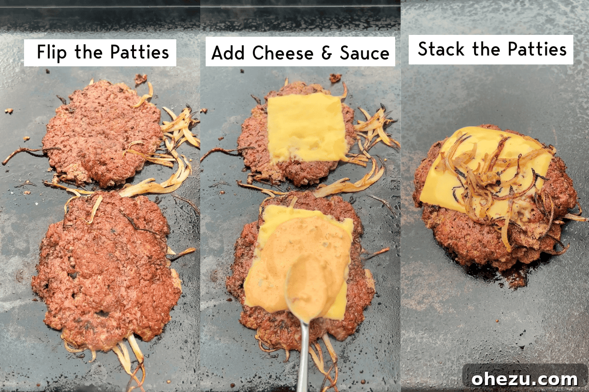 Melted cheese slices added to the smashed burger patties on the griddle
