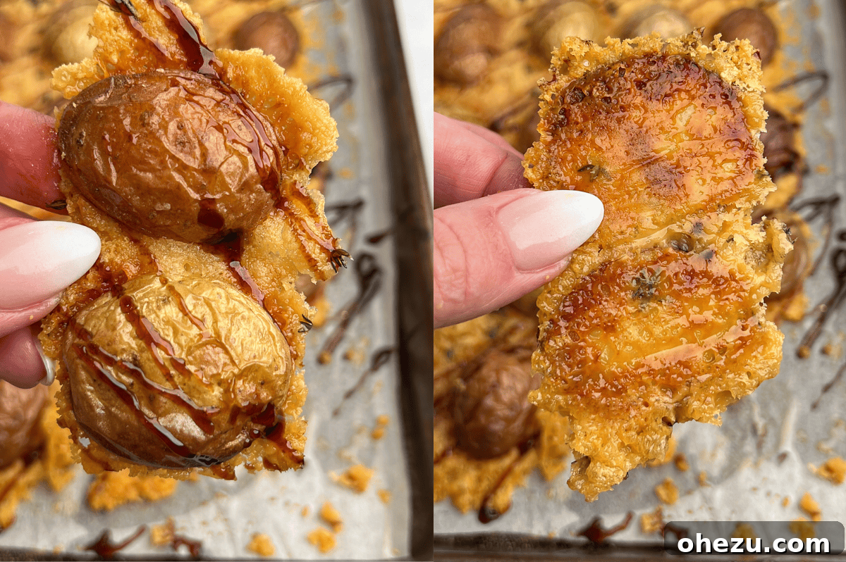 Close-up of crispy Parmesan roasted potatoes arranged on a baking sheet, showing the perfect crust.