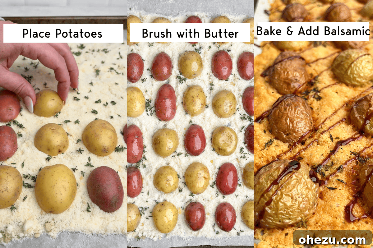 A baking sheet filled with golden, crispy Parmesan roasted potatoes fresh out of the oven, drizzled with balsamic glaze.