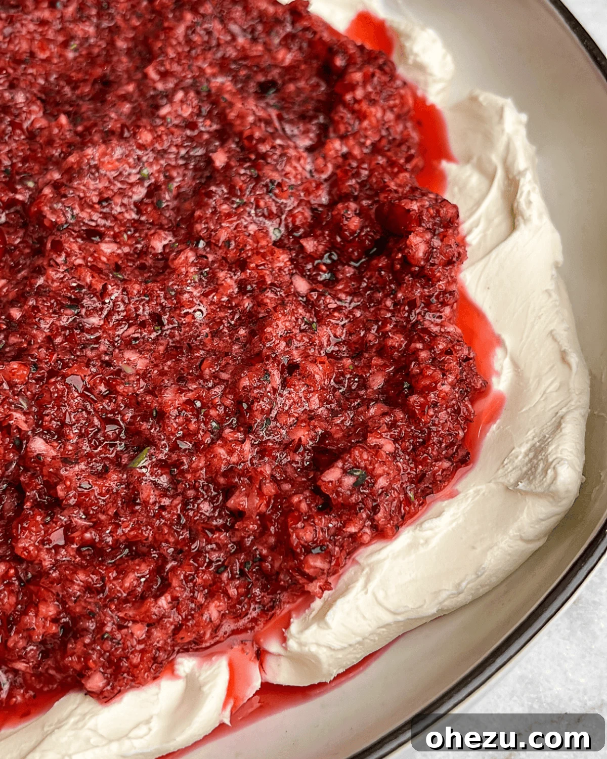 Sweet Heat Cranberry Jalapeno Dip 3 a close up image of the cranberry relish on top of cream cheese