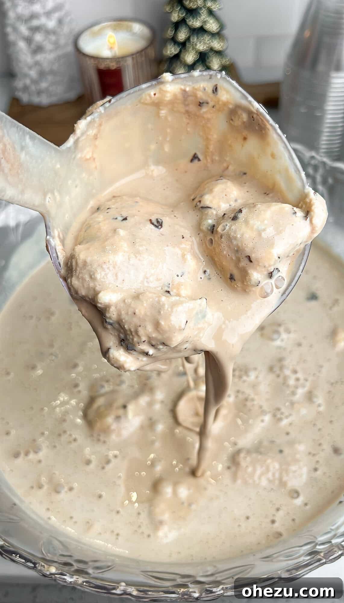 Velvet Coffee Blend 3 Pouring ice cream punch from a ladle into a glass from a large punch bowl.