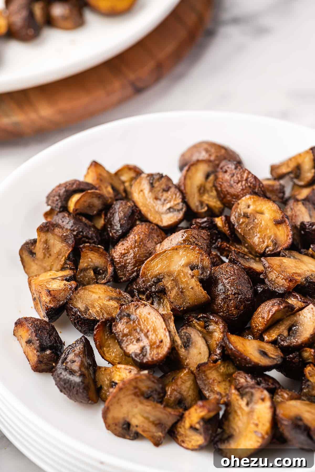 air fryer mushrooms presented on a white plate