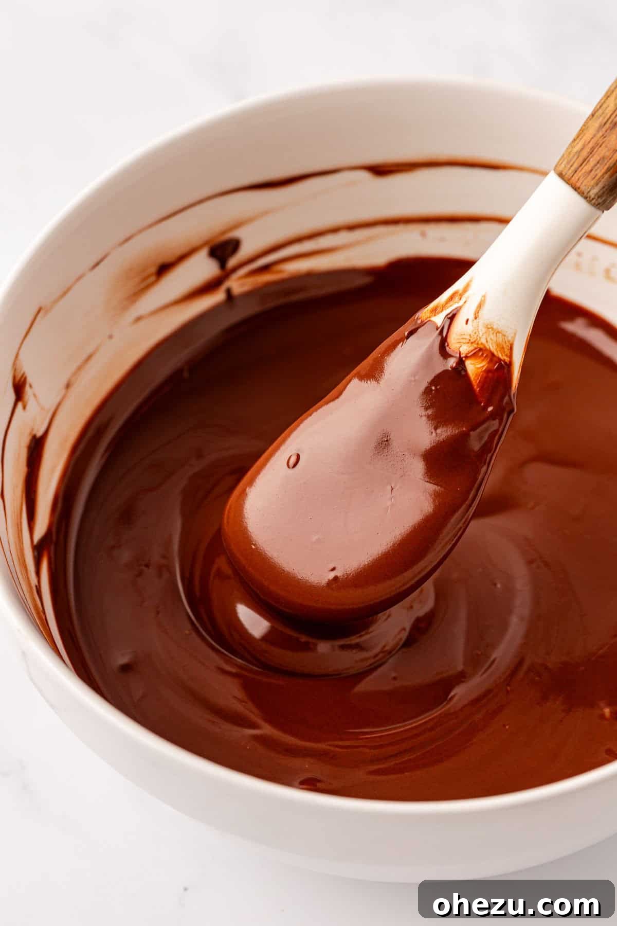 Smooth, melted chocolate with coconut oil in a bowl
