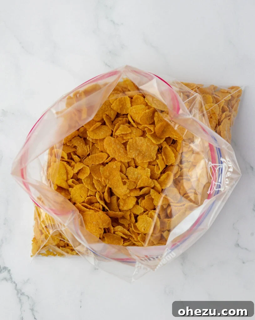 Corn flakes being measured into a ziploc bag for crushing