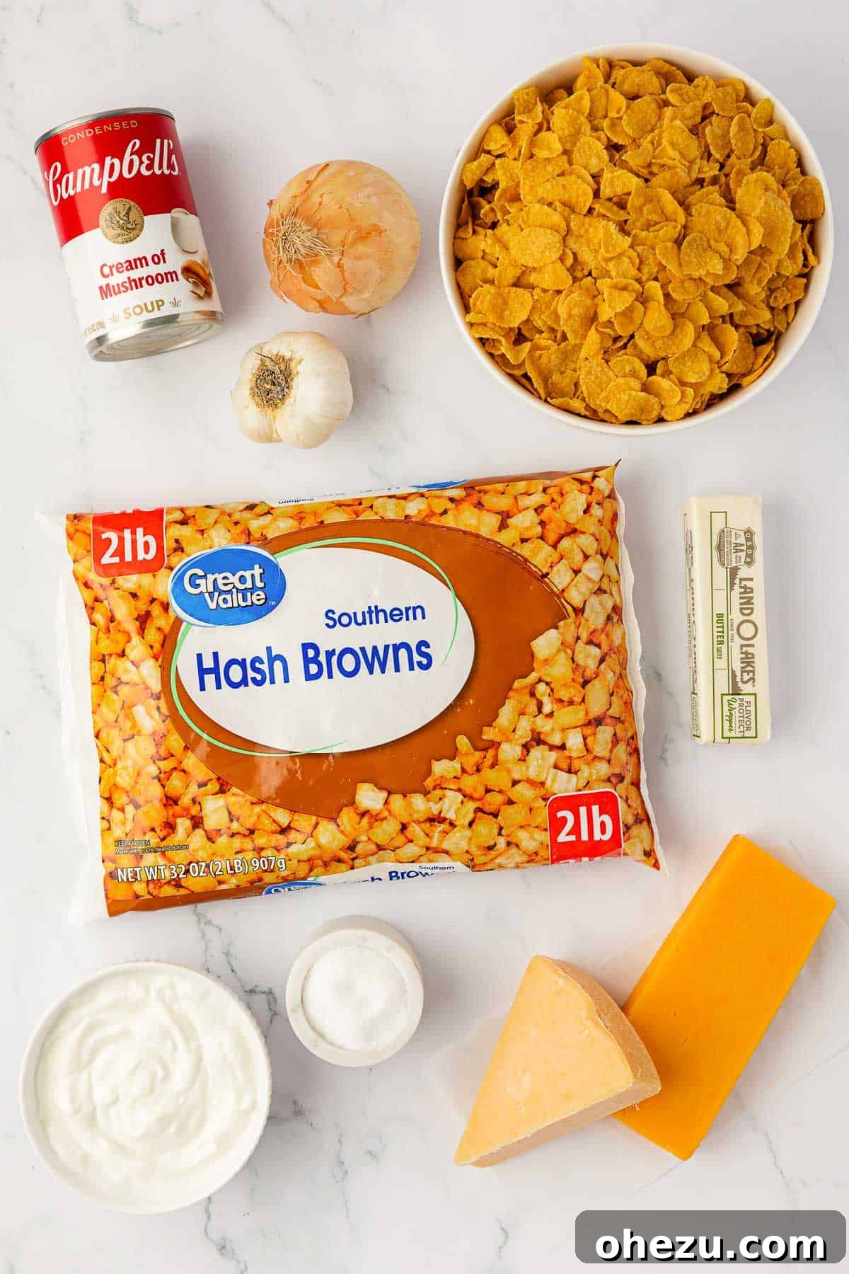 All ingredients laid out on a kitchen counter, ready for making cheesy potatoes with corn flakes