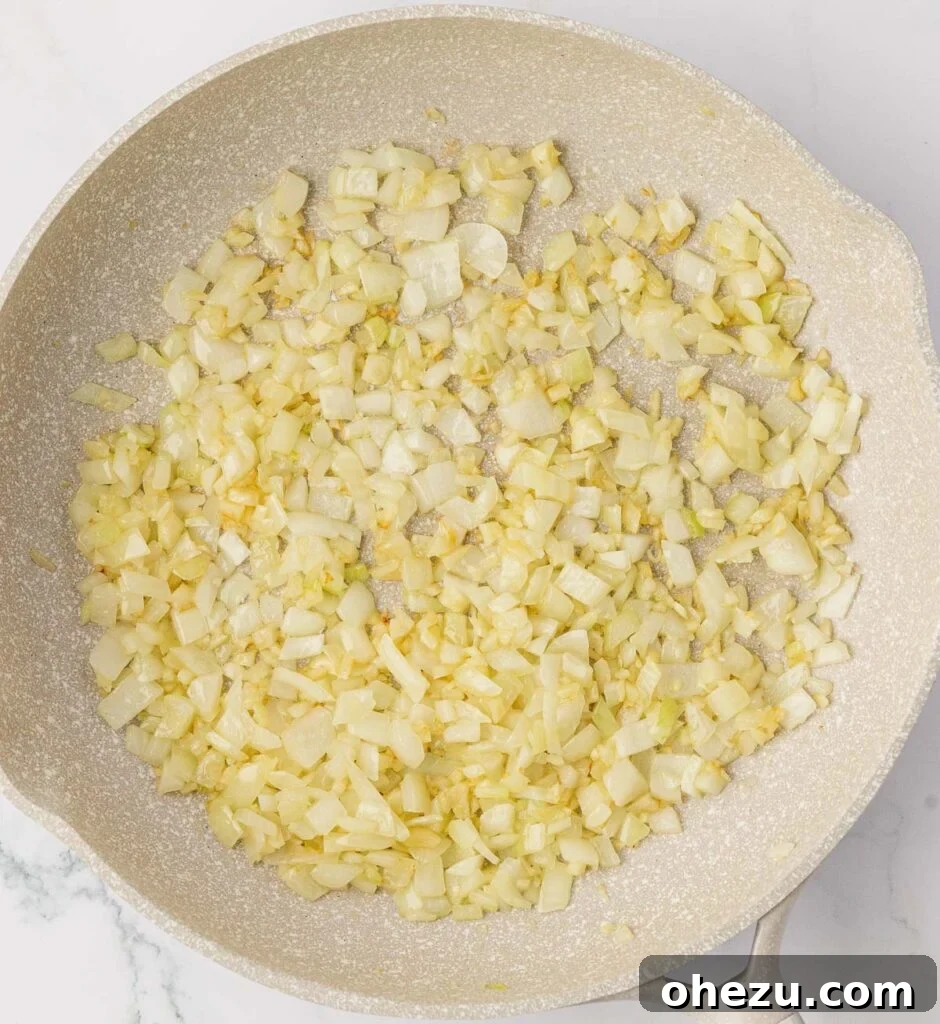 Diced garlic, onion, and melting butter in a hot skillet