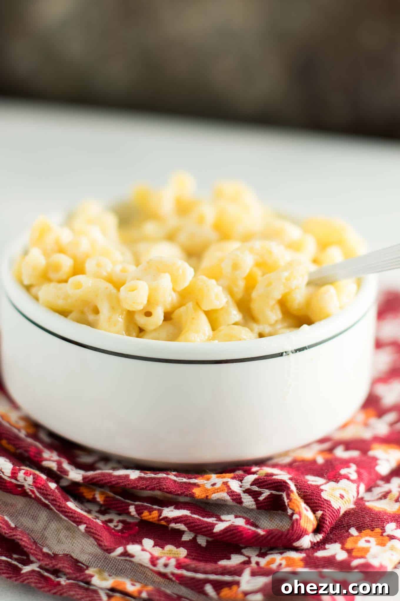 A perfect serving of sharp cheddar mac and cheese in a bowl, ready for enjoyment