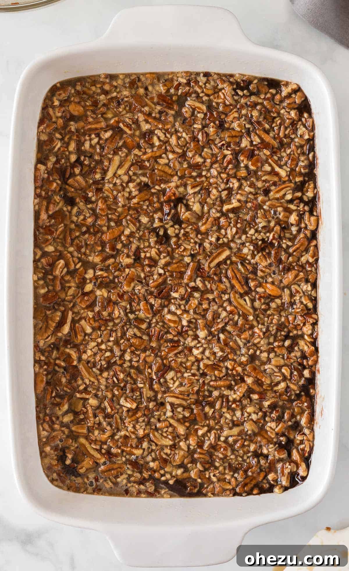 pecan pie layer poured over the brownies