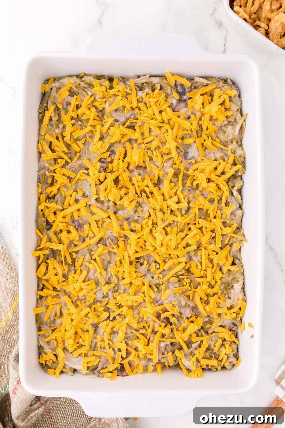 Holiday Green Bean Bake 8 adding the cheddar cheese