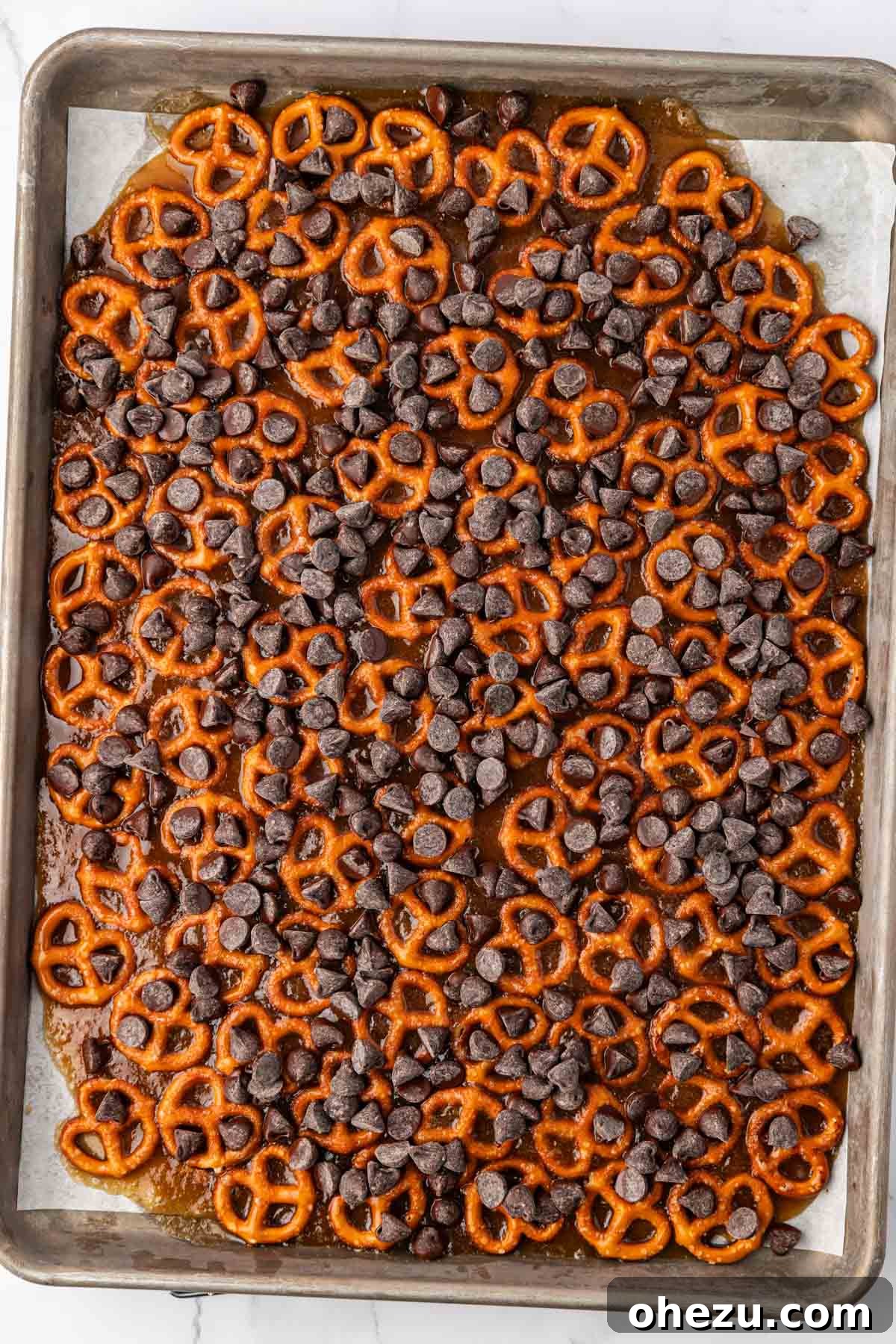 chocolate chips sprinkled over the toffee pretzels