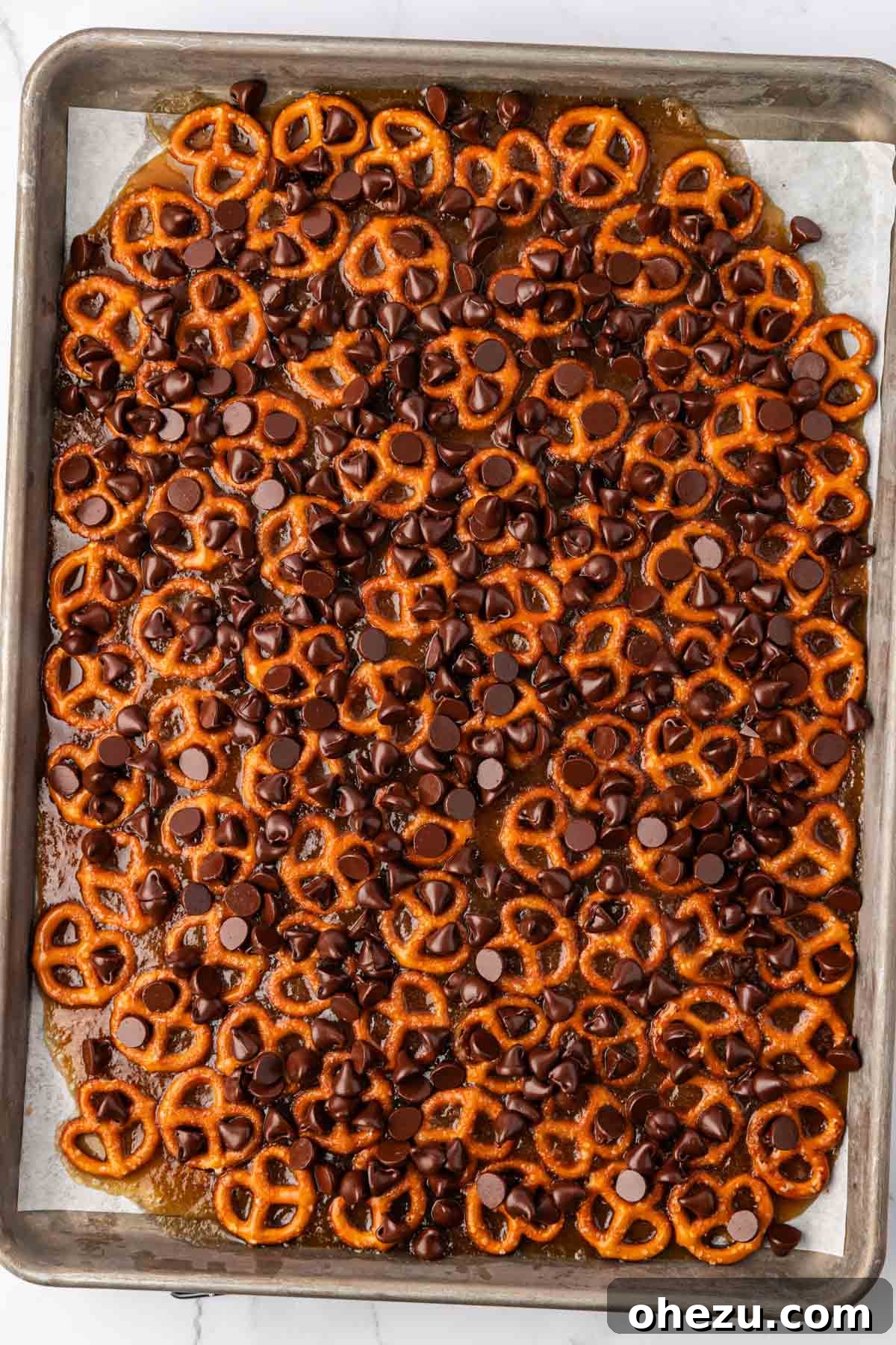 chocolate chips sprinkled over the toffee pretzels