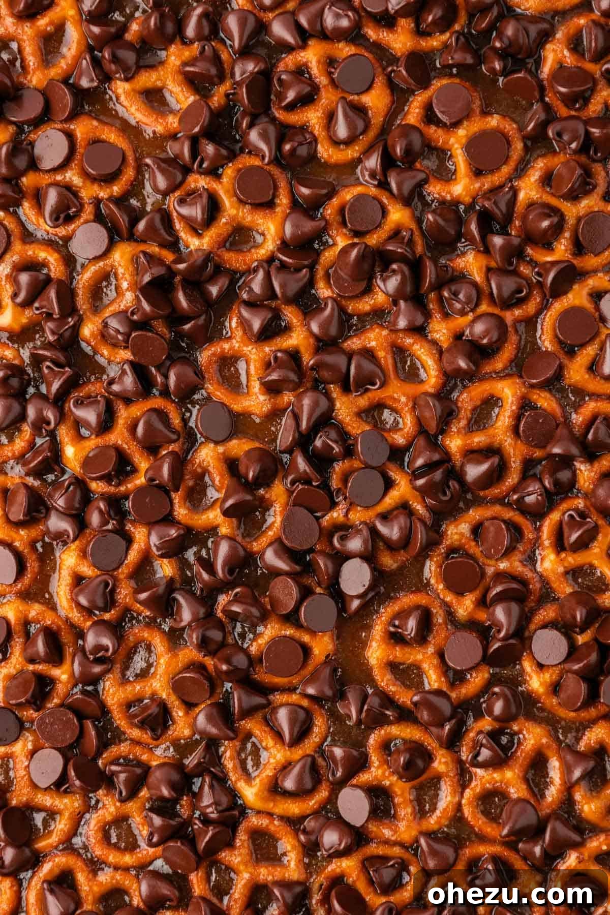 melted chocolate chips sprinkled over the toffee pretzels