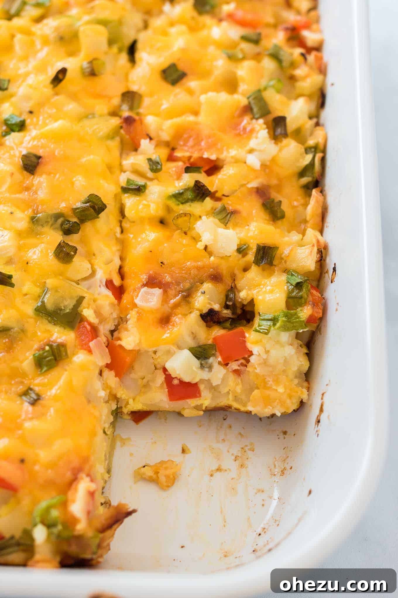 Sunrise Hash Brown Egg Bake 12 The baked hash brown egg casserole, perfectly cut into squares within the baking dish, ready to be served.