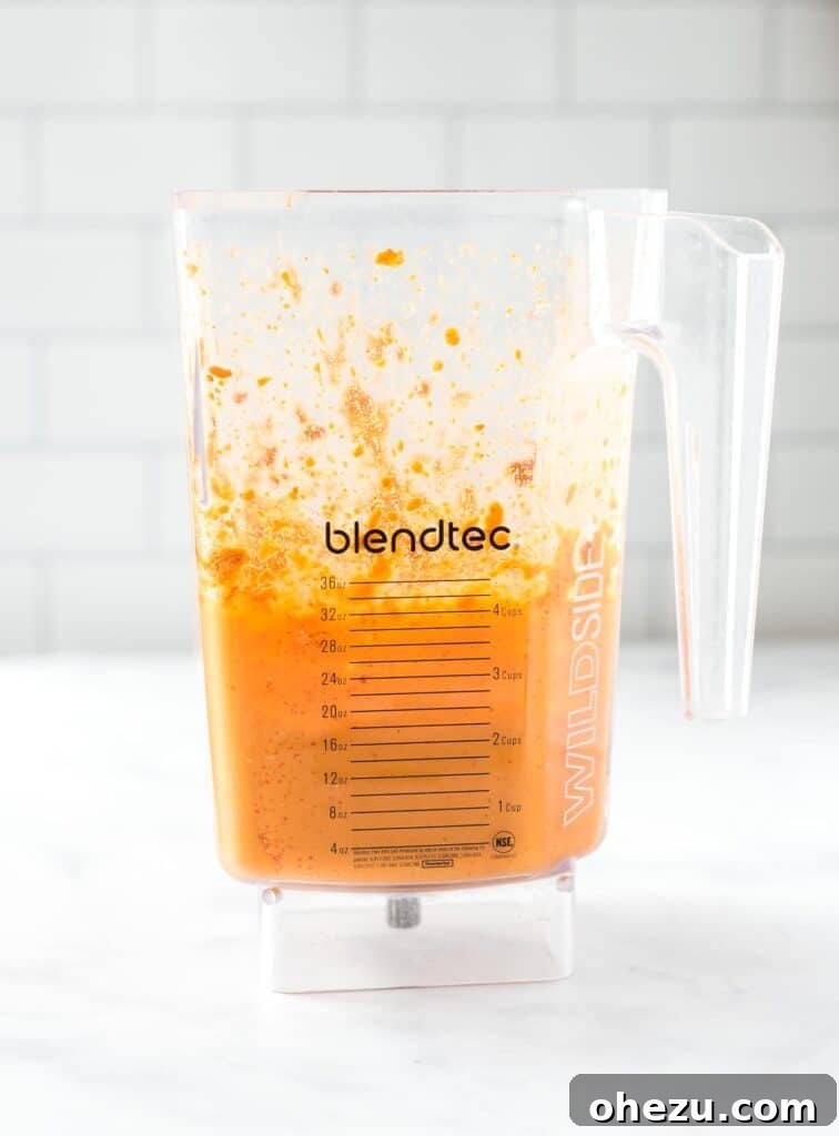 Vegan queso blending smoothly in a Blendtec blender