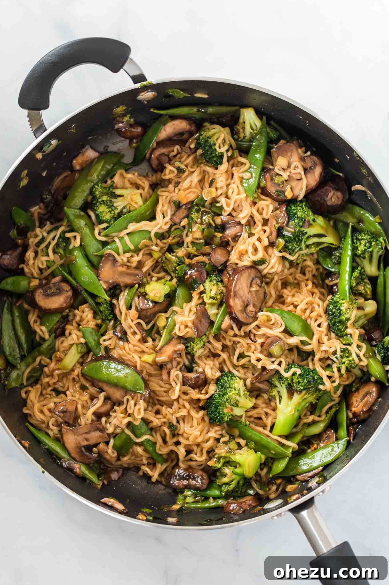 Sweet and Savory Teriyaki Noodles 6 A close-up of a serving of Teriyaki Ramen Noodles with vibrant vegetables, garnished and ready to enjoy.