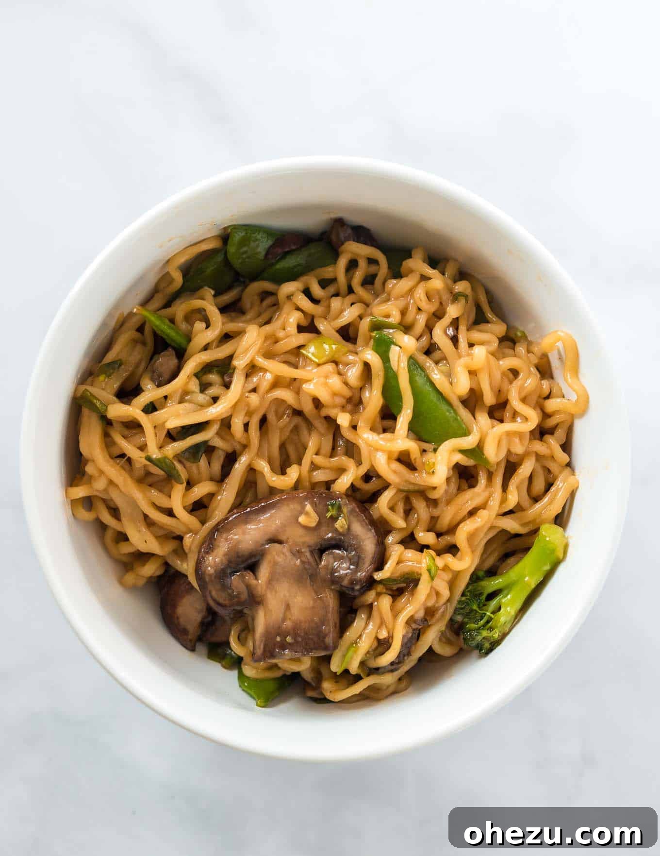 Sweet and Savory Teriyaki Noodles 8 A beautifully presented bowl of Teriyaki Ramen Noodles, brimming with colorful vegetables and glazed with a homemade sauce.