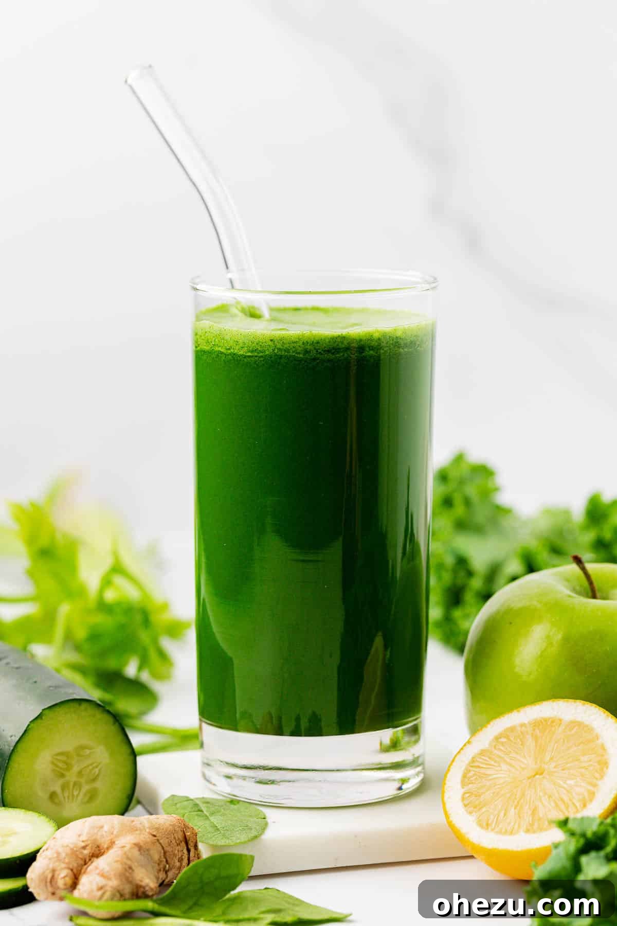 Vibrant Green Goodness 14 A glass of green juice with a straw, reflecting sunlight, creating an inviting visual.