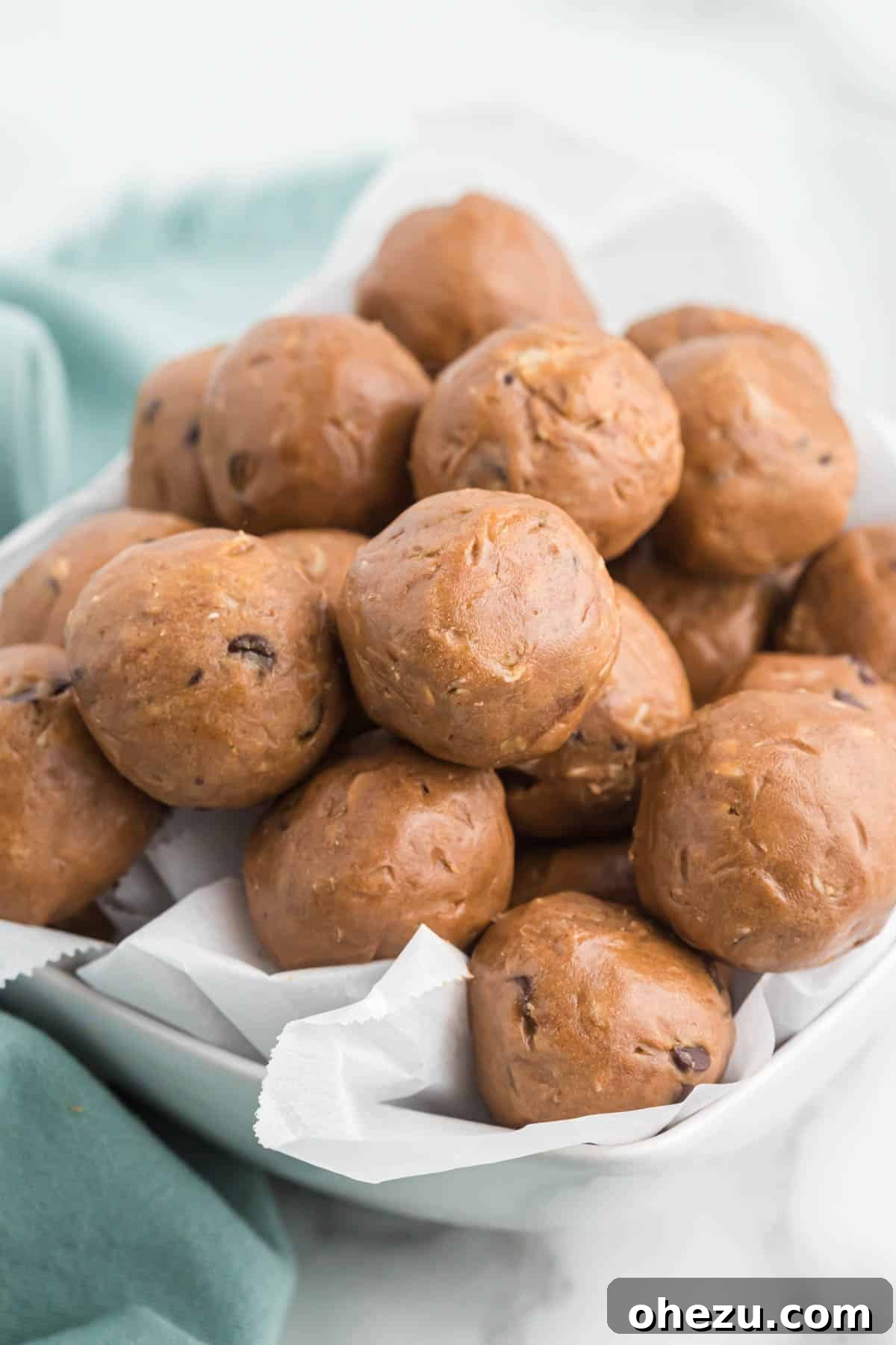 chocolate protein balls stacked in a bowl
