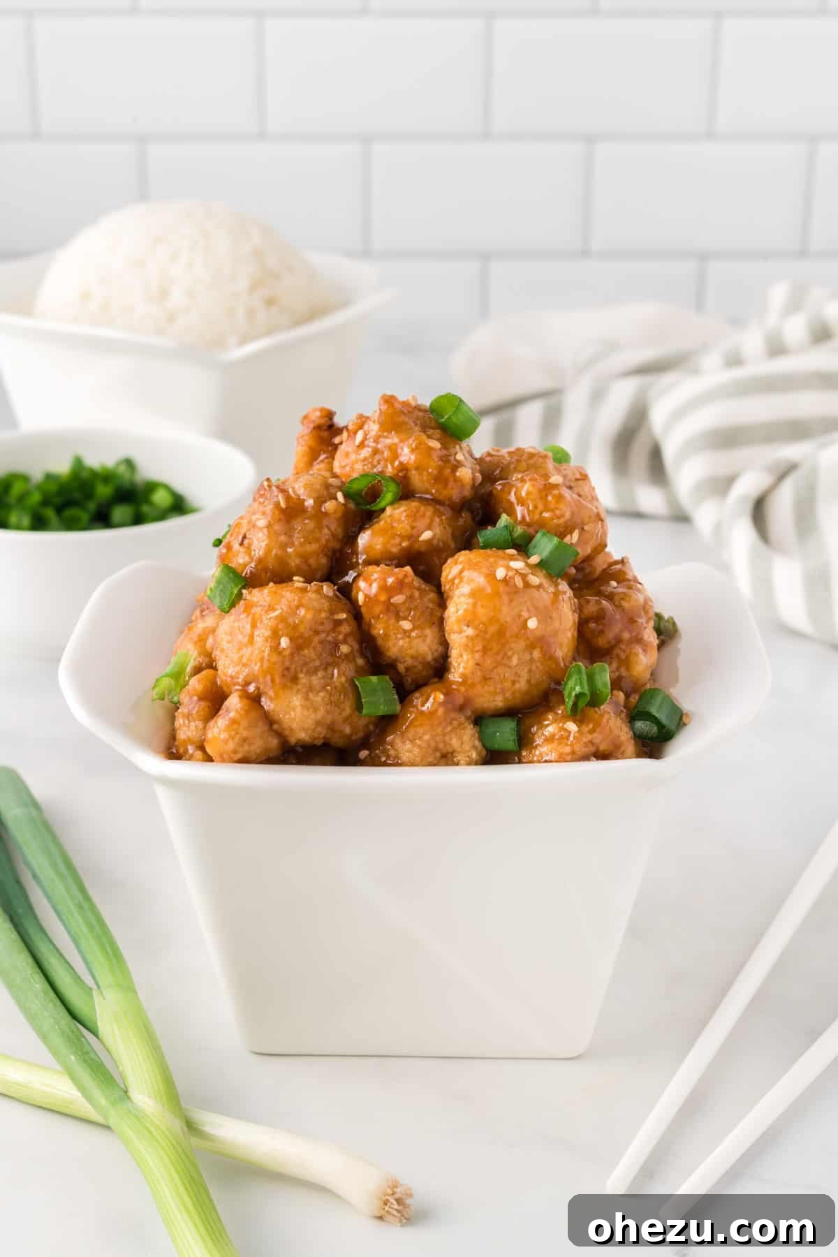 teriyaki cauliflower in a takeout container