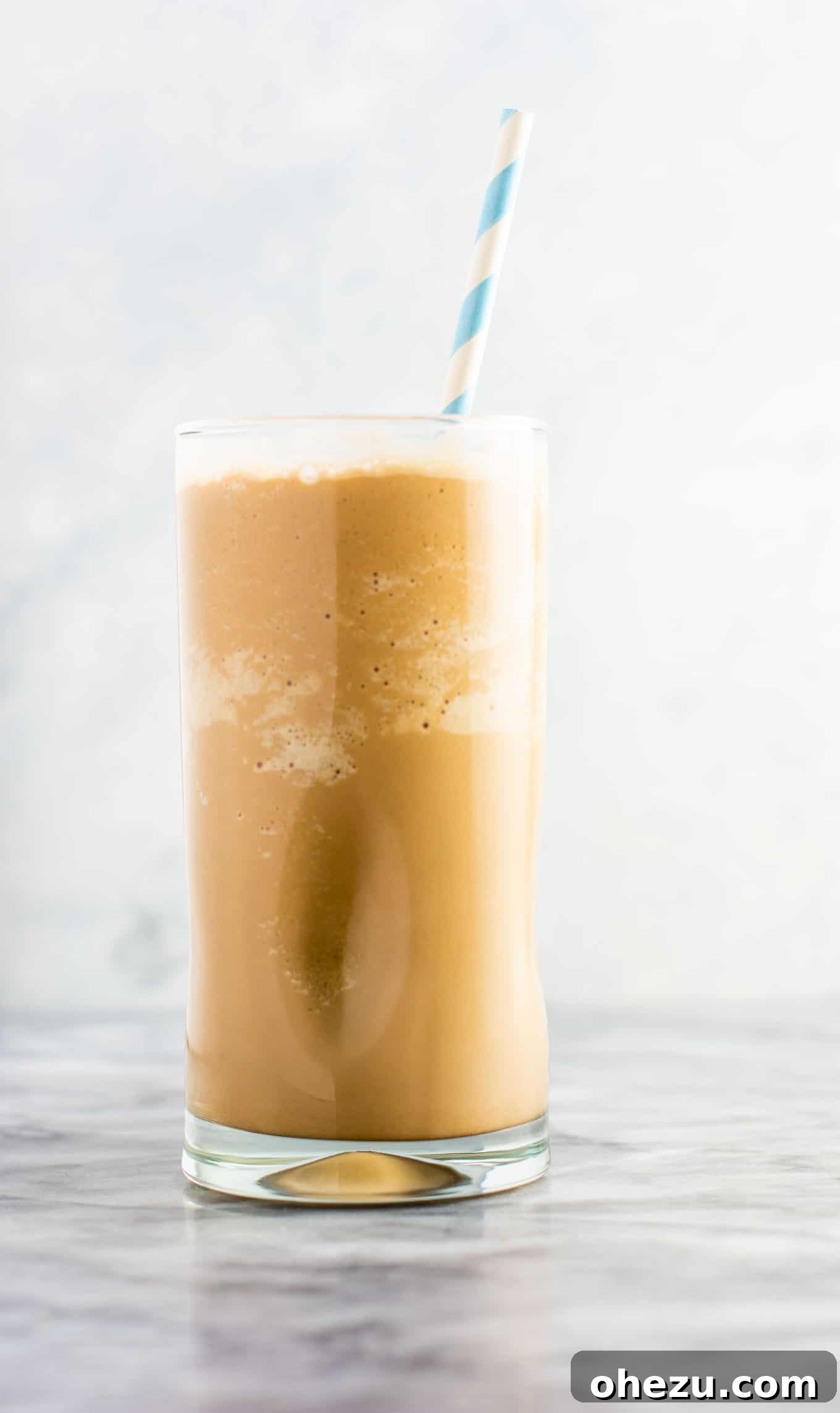 Close-up of a refreshing easy frozen coffee in a clear glass