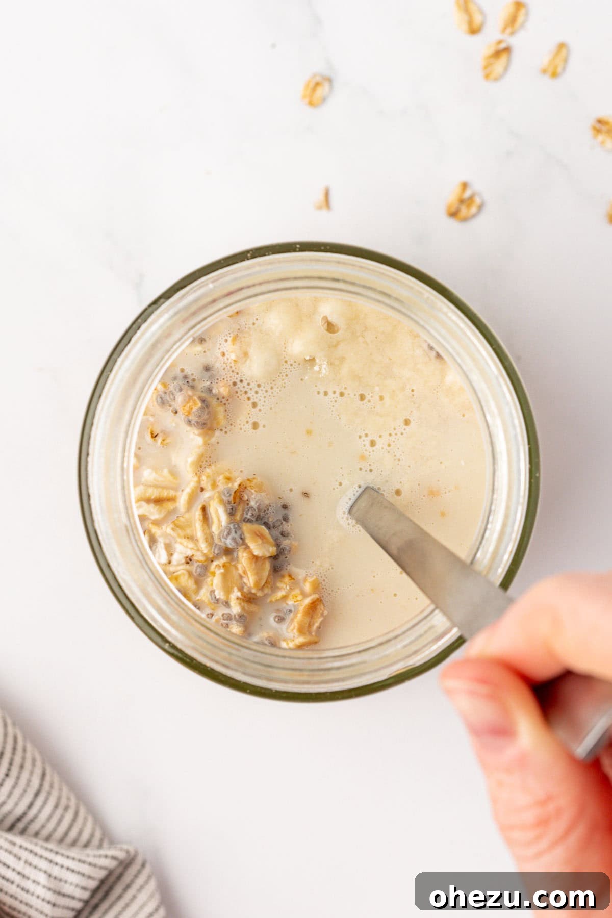 stirring the overnight oats ingredients together