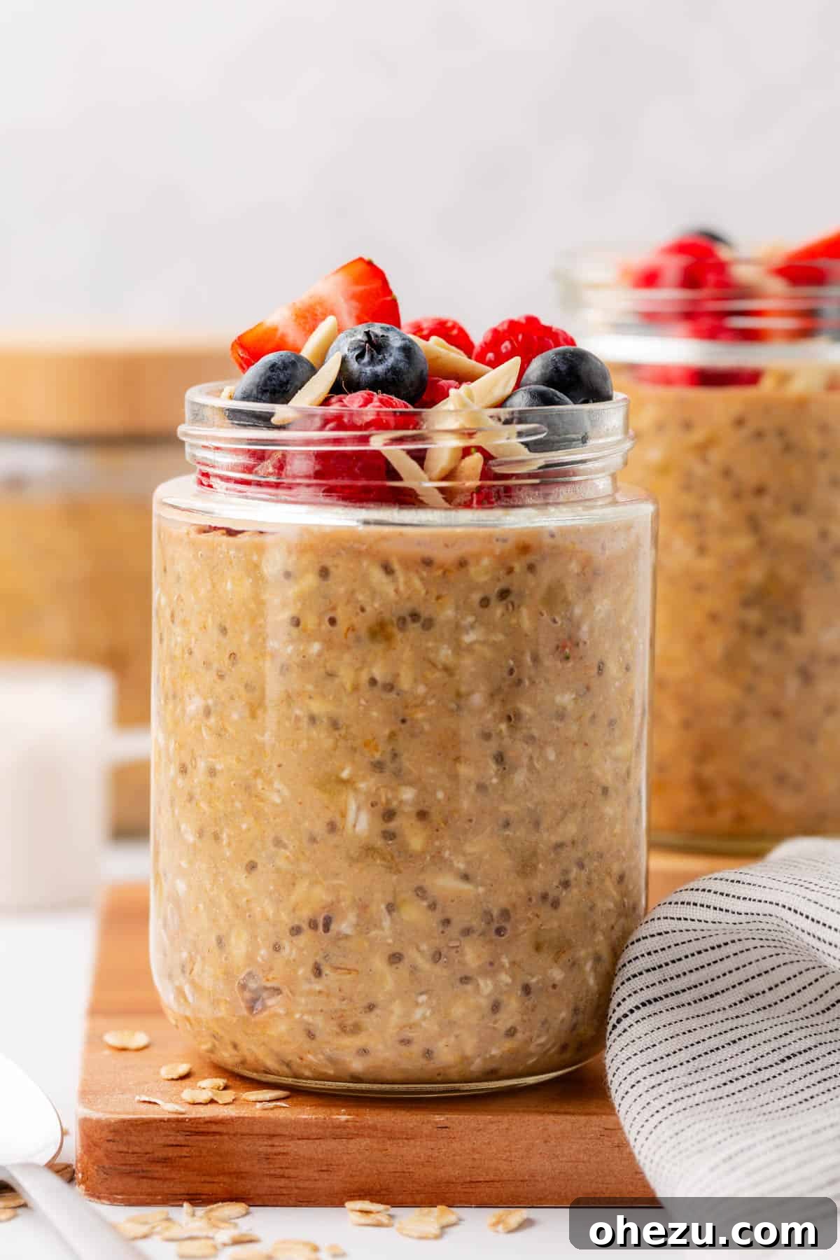 protein overnight oats topped with berries and almonds
