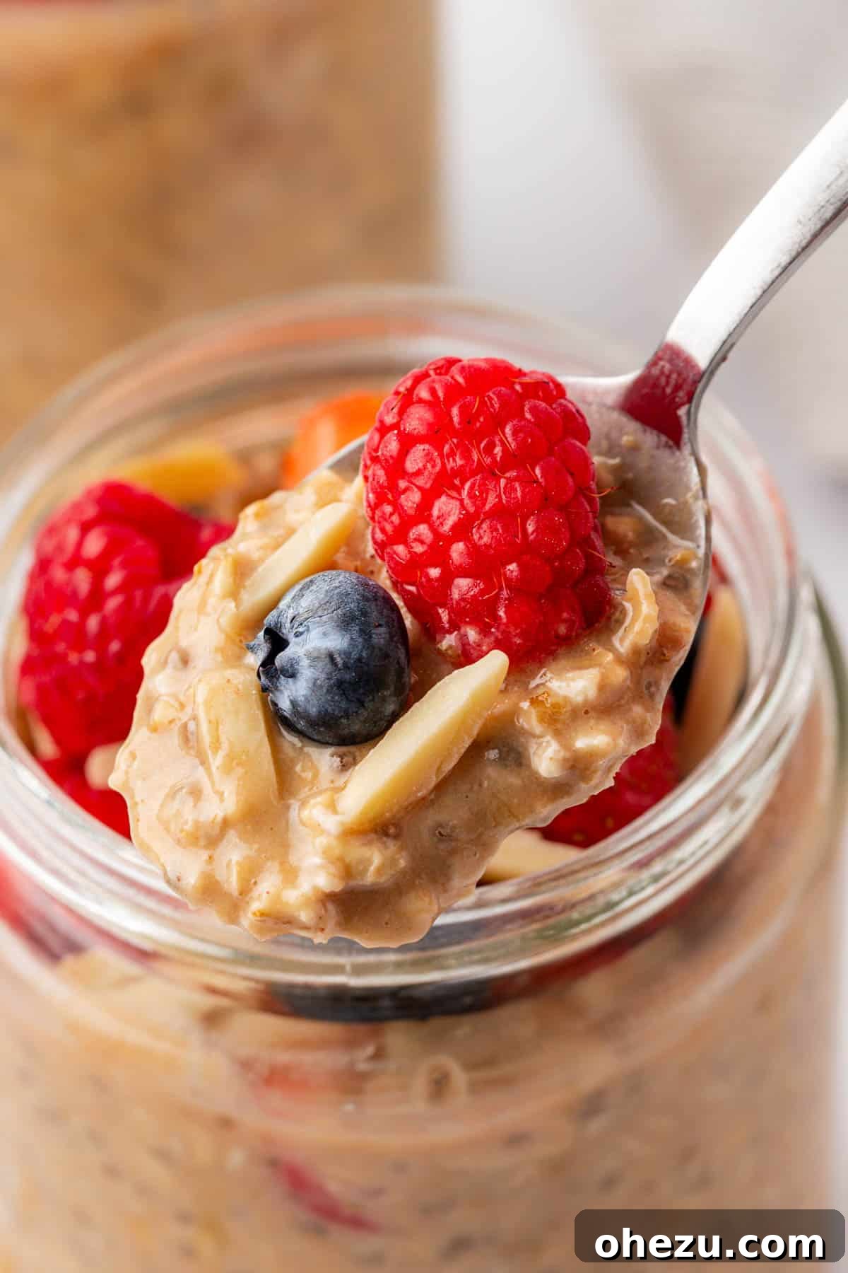 protein overnight oats topped with berries and almonds