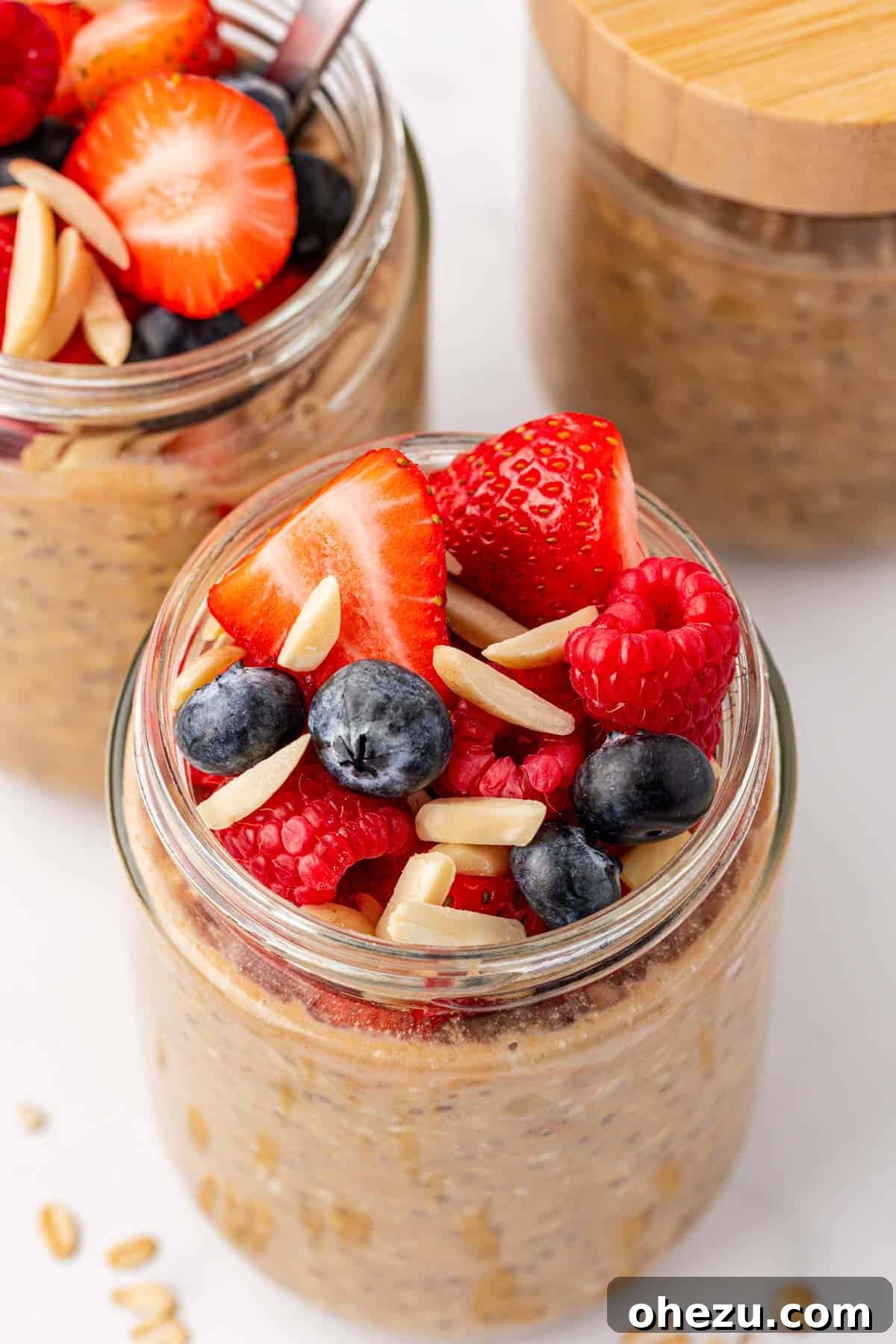 protein overnight oats topped with berries and almonds
