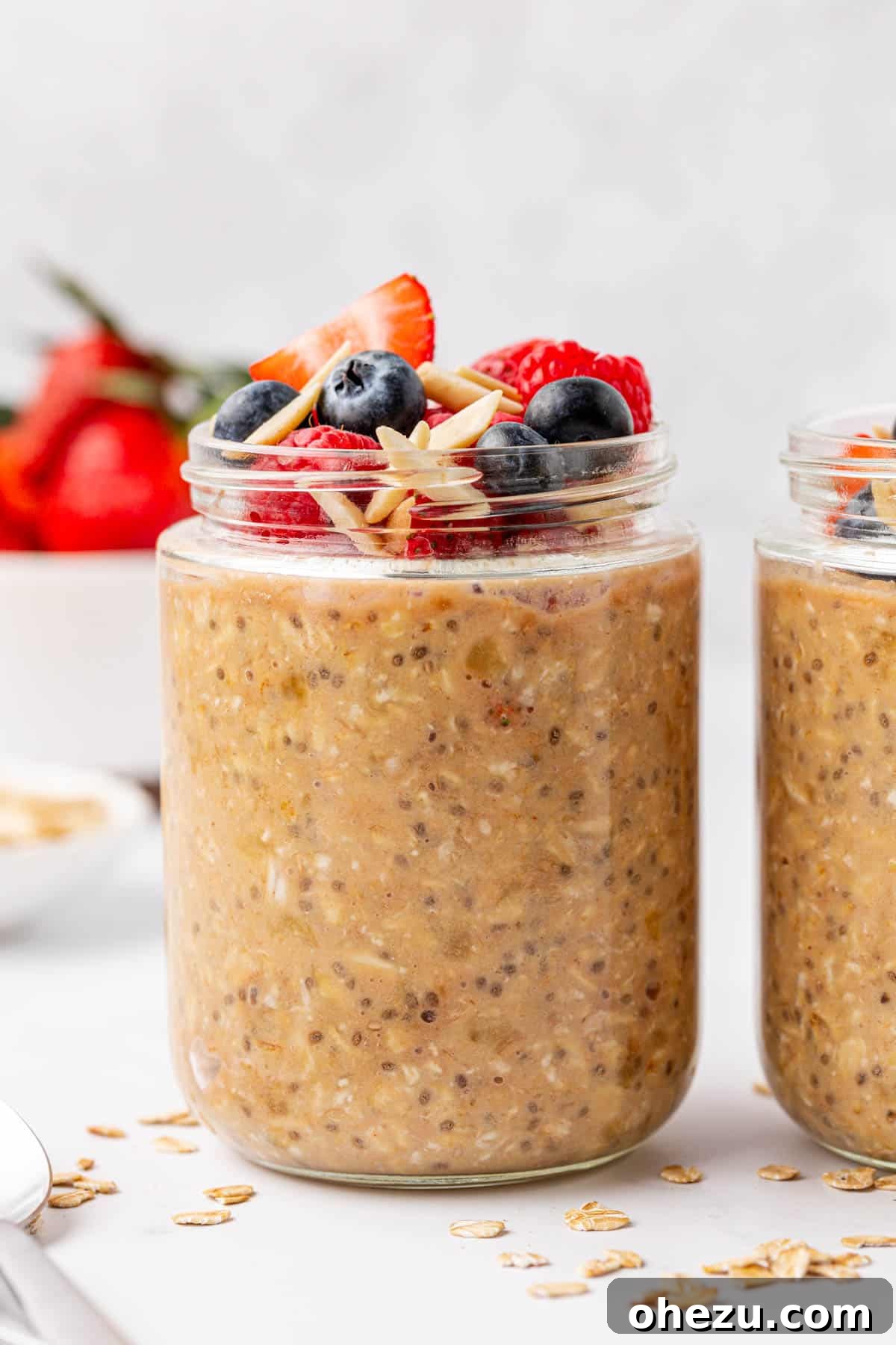 protein overnight oats topped with berries and almonds