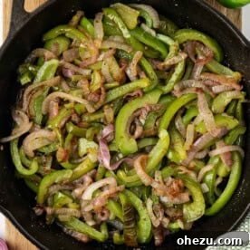 Zesty Fajita Medley 12 A close-up of tender-crisp fajita veggies in a skillet, showcasing their vibrant colors and perfect texture.