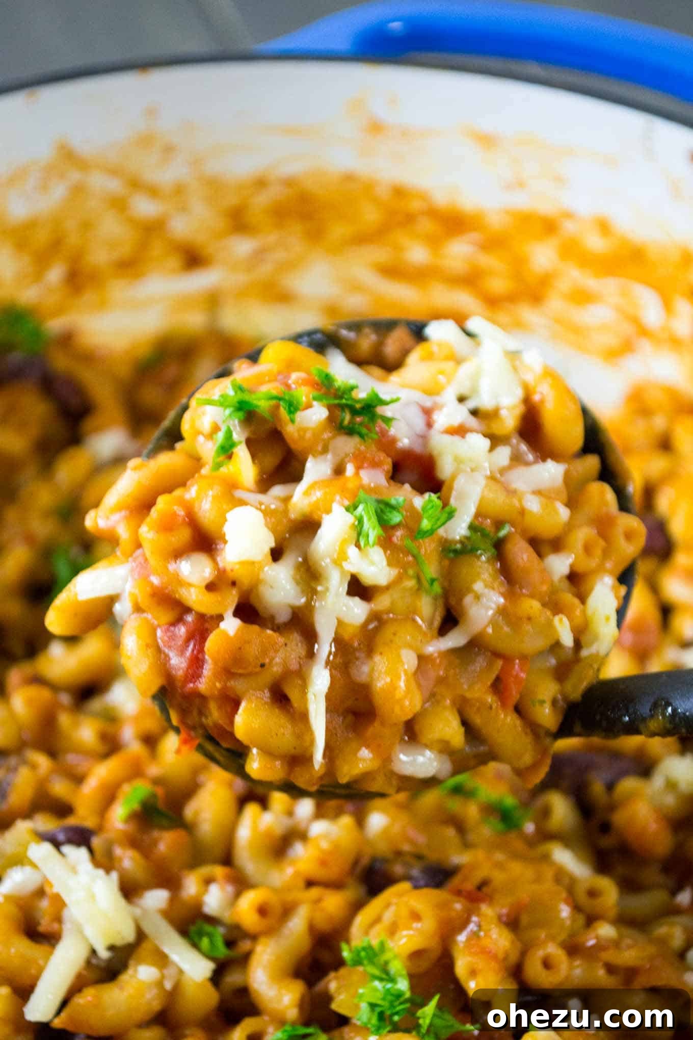 Comforting Vegetarian Chili Mac Skillet 6 Stirring sharp cheddar cheese into hot vegetarian chili mac