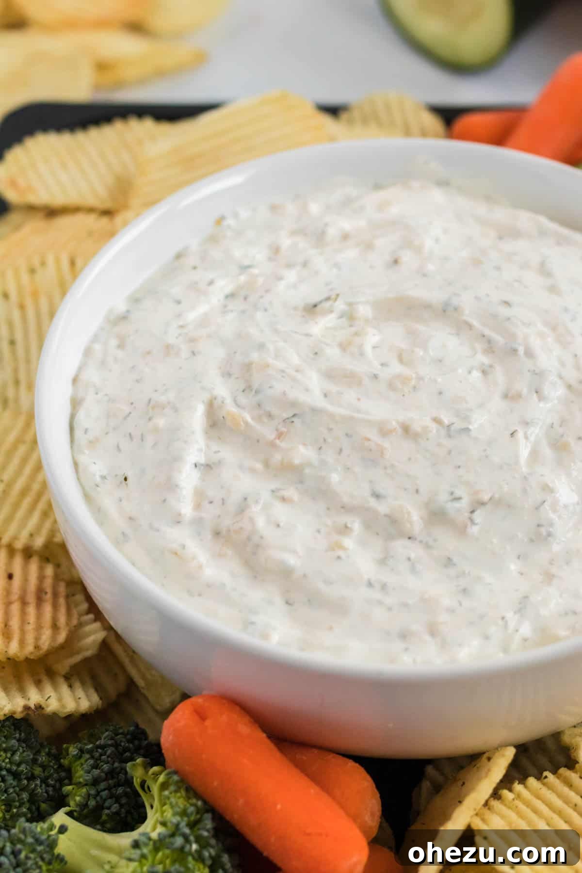 A beautifully presented bowl of creamy homemade chip dip, ready to be enjoyed, showcasing its smooth texture and inviting color.