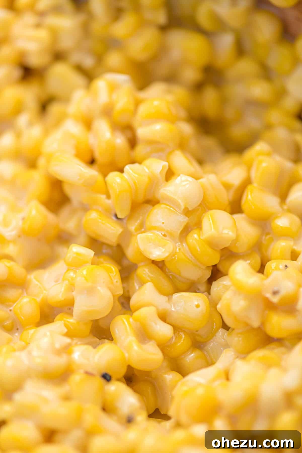 A large skillet filled with creamy honey butter corn, ready to be served