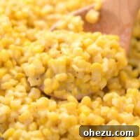Honey Butter Skillet Corn in a bowl with a serving spoon