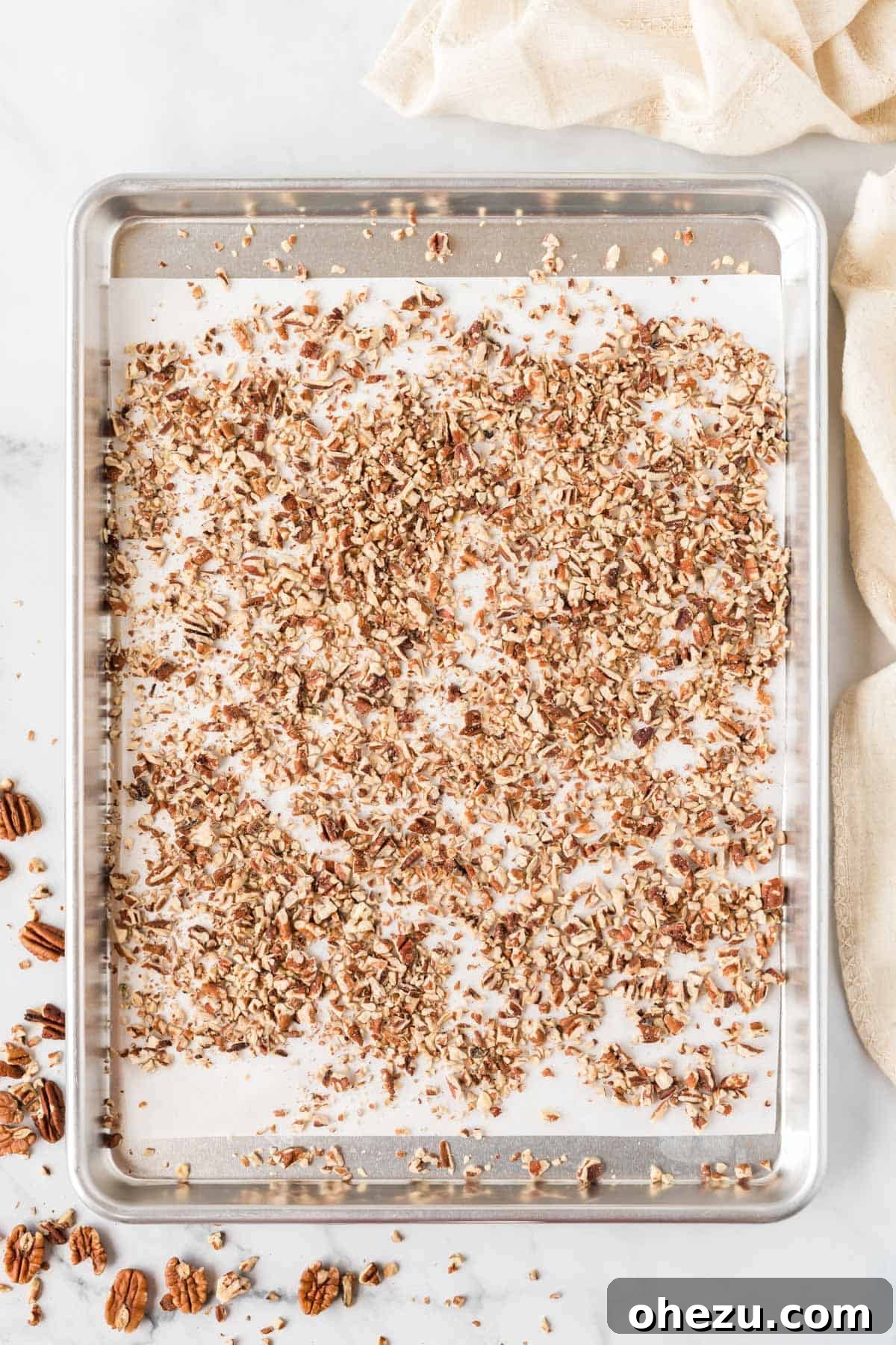 pecans on a baking sheet