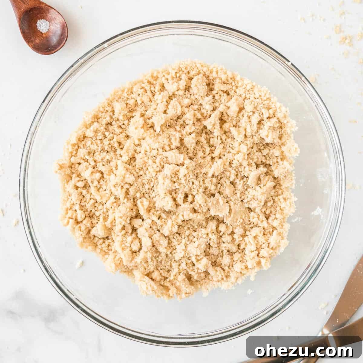 Crumbly streusel topping in a mixing bowl, perfectly prepared