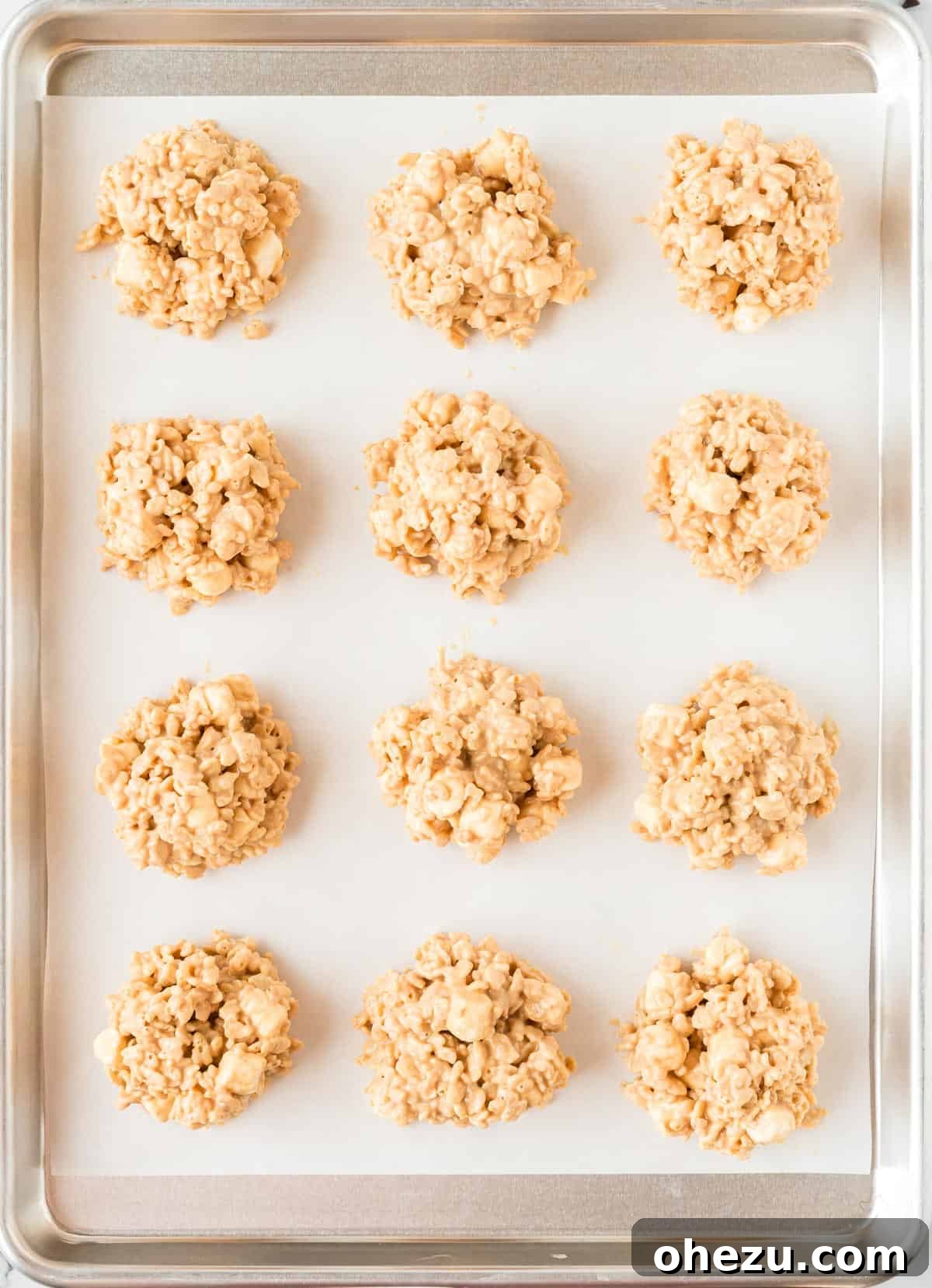 Kitchen Sink Cookies 11 No bake avalanche cookies neatly formed and scooped onto a baking sheet lined with parchment paper