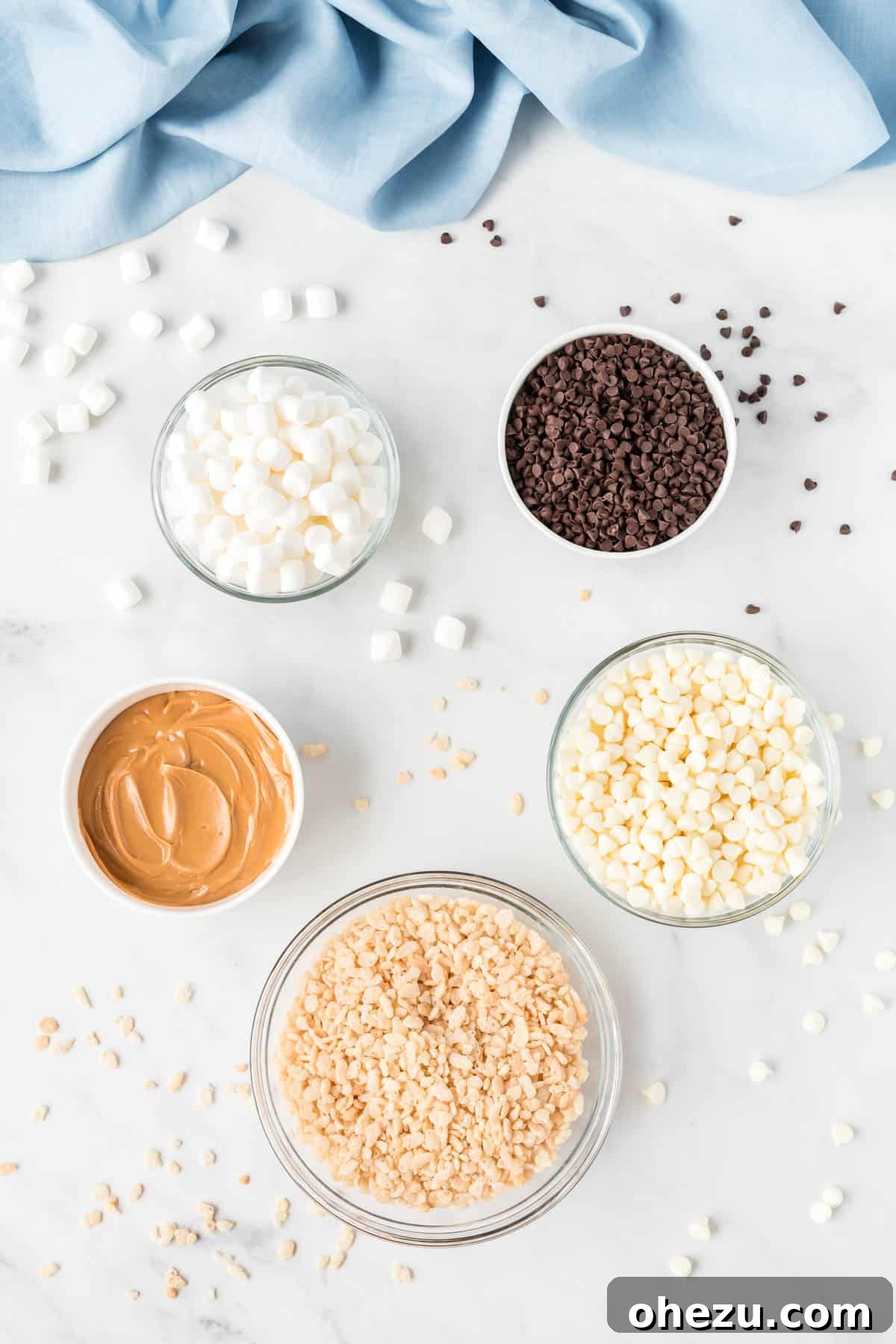 Kitchen Sink Cookies 4 All five key ingredients for no bake avalanche cookies laid out neatly in separate glass bowls