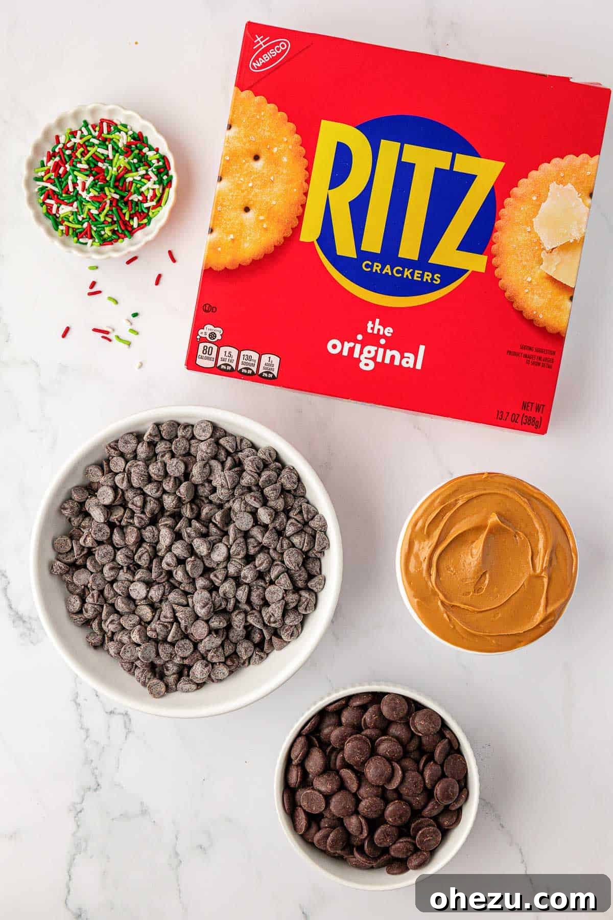 Ingredients for Ritz Cracker Cookies laid out, including Ritz crackers, peanut butter, and chocolate chips.