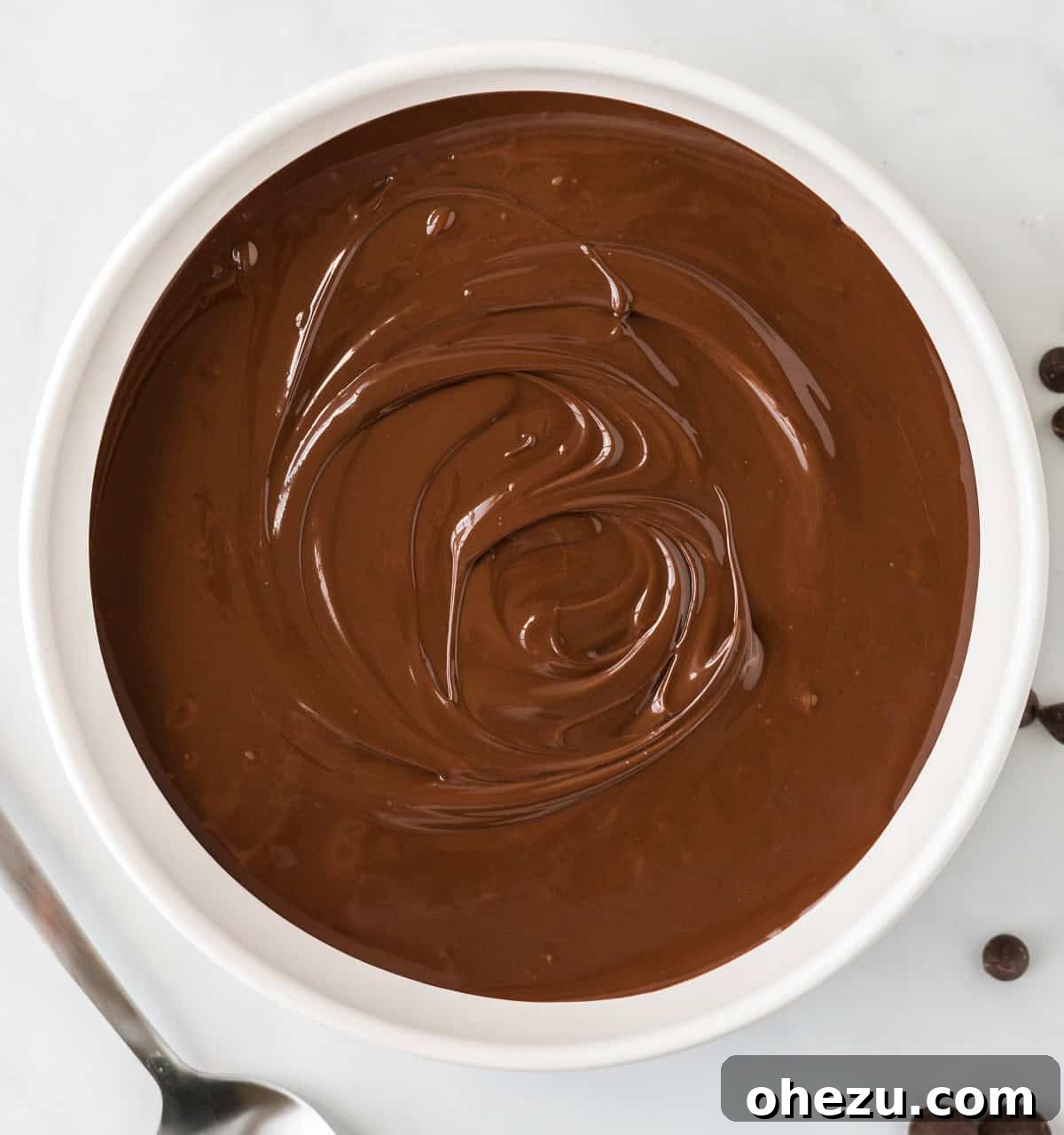 A bowl of perfectly melted chocolate, smooth and ready for dipping